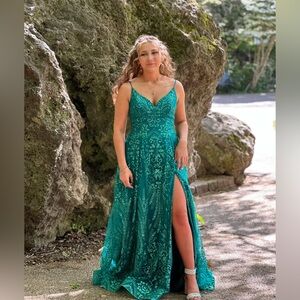 Beautiful formal gown. Loaded with sparkles. Corset style back.